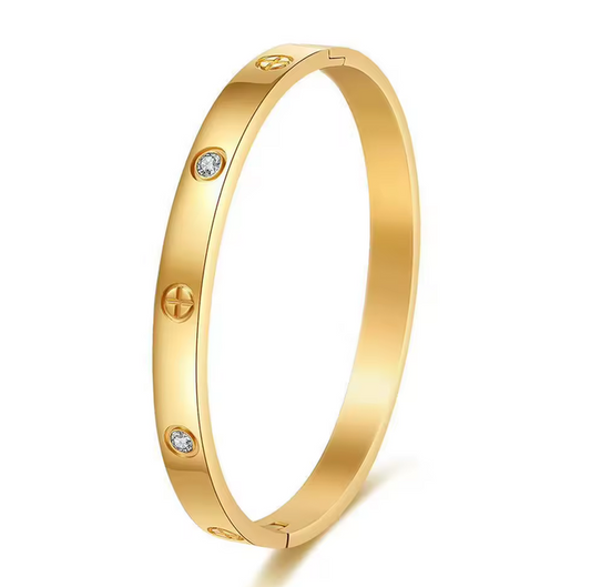 Cross bangle with zircons